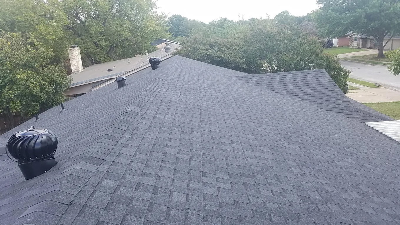Completed dark charcoal roof replacement — DFW