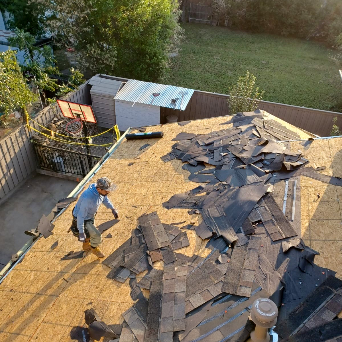 WAS Construction crew performing full roof tear-off